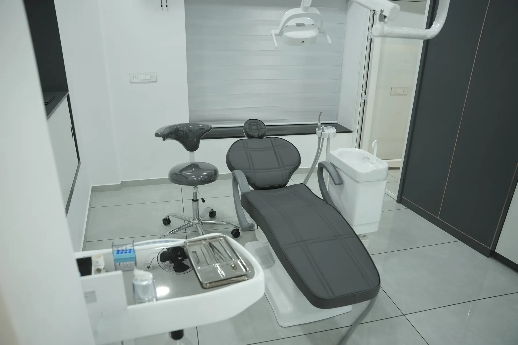 Second dental chair setup at Dental Craft Vanchiyoor with overhead light and sink